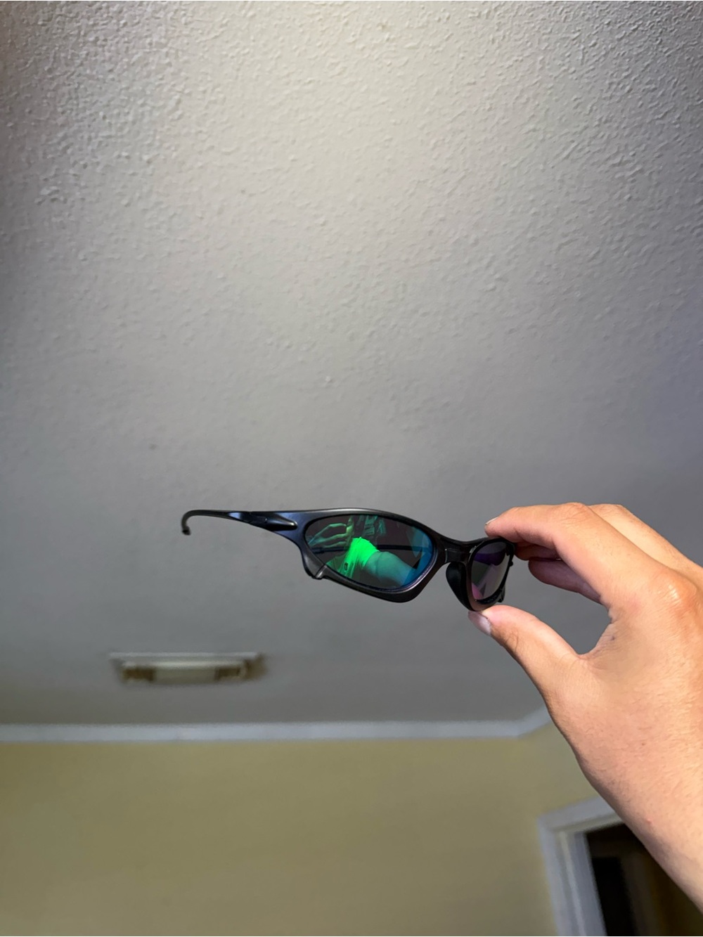 Sleek Black Sunglasses with Green Mirrored Lenses Oakley